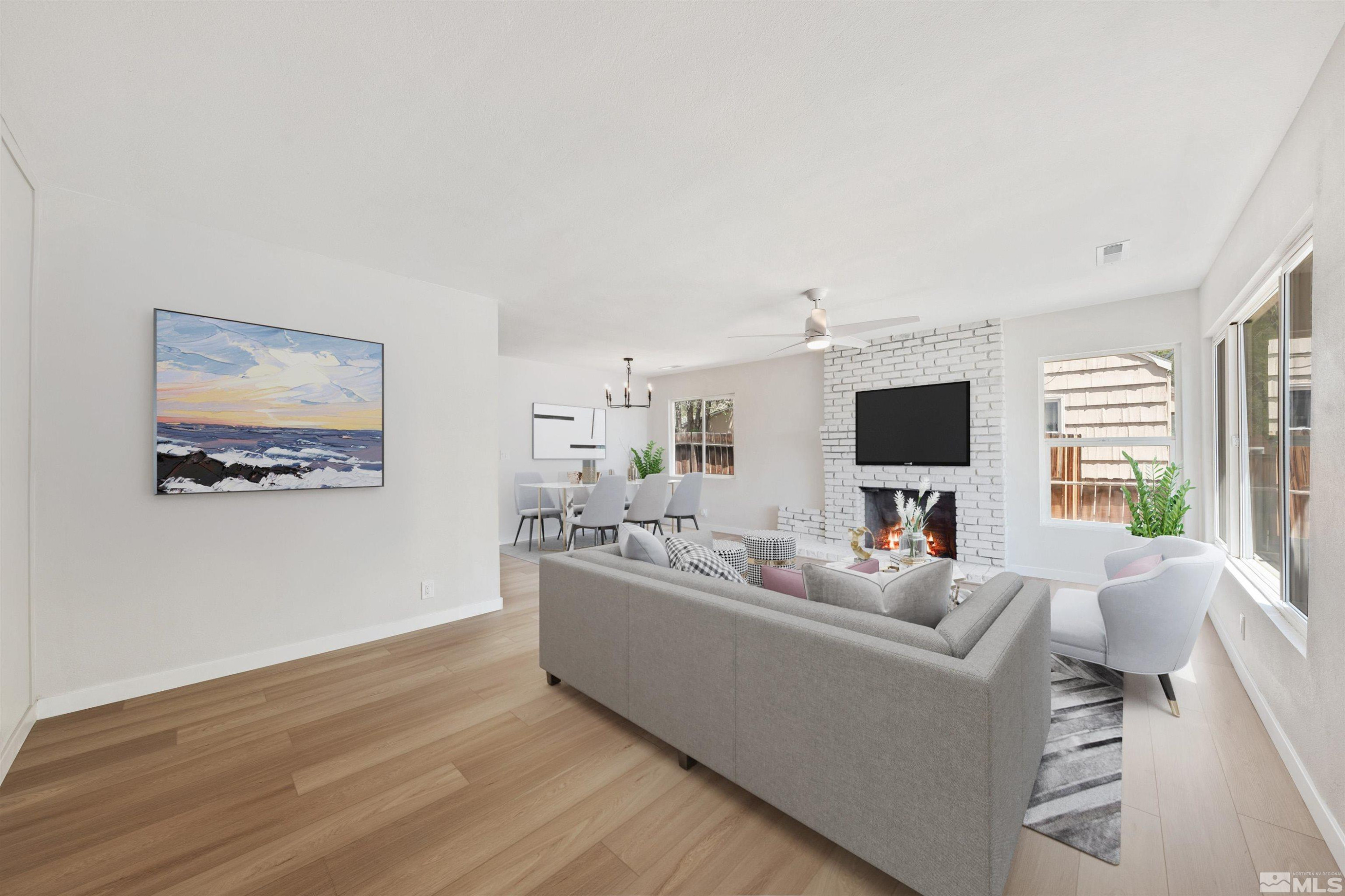 983 Melba Drive Reno, NV 89503 - Photo 5 of 39 a living room with furniture and a flat screen tv