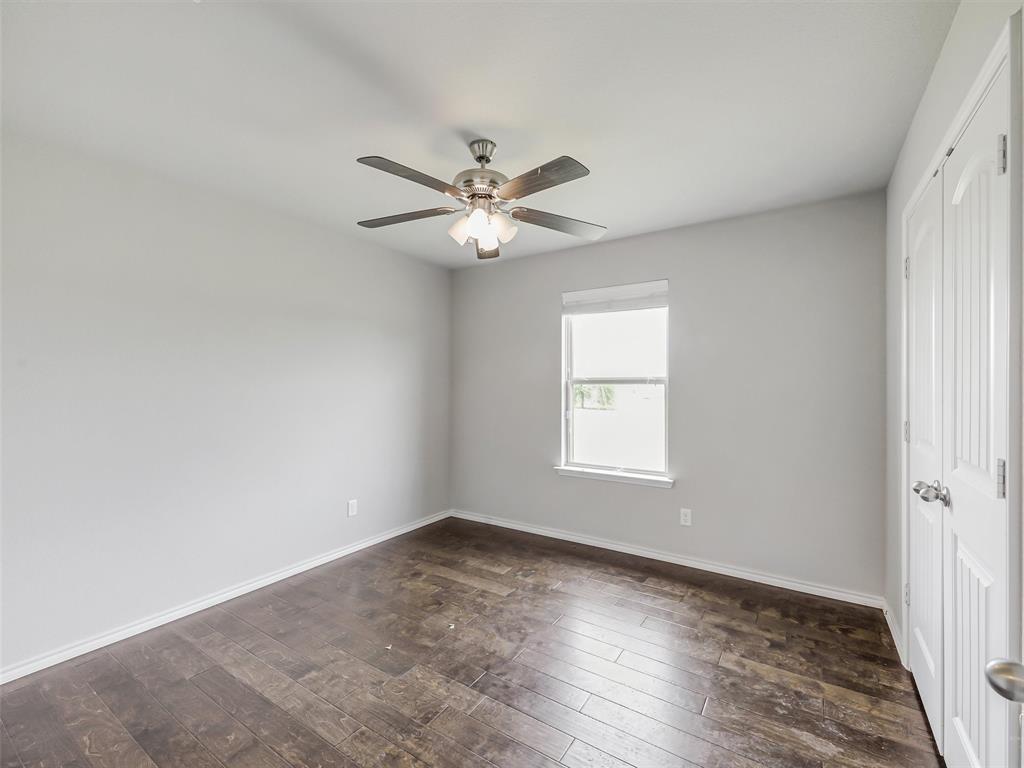 132 County Road 4213 Decatur, TX 76234 - Photo 18 of 27 wooden floor in an empty room with a window
