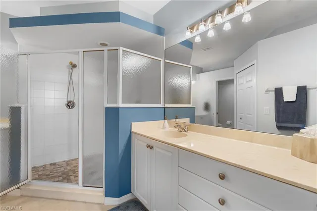 a bathroom with a sink double vanity and a mirror
