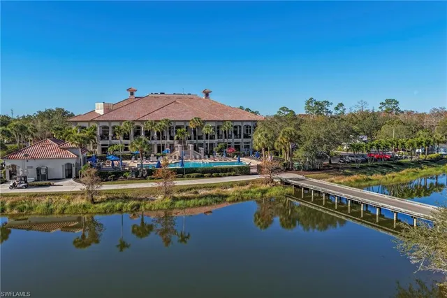 a view of a swimming pool with a lounge chair