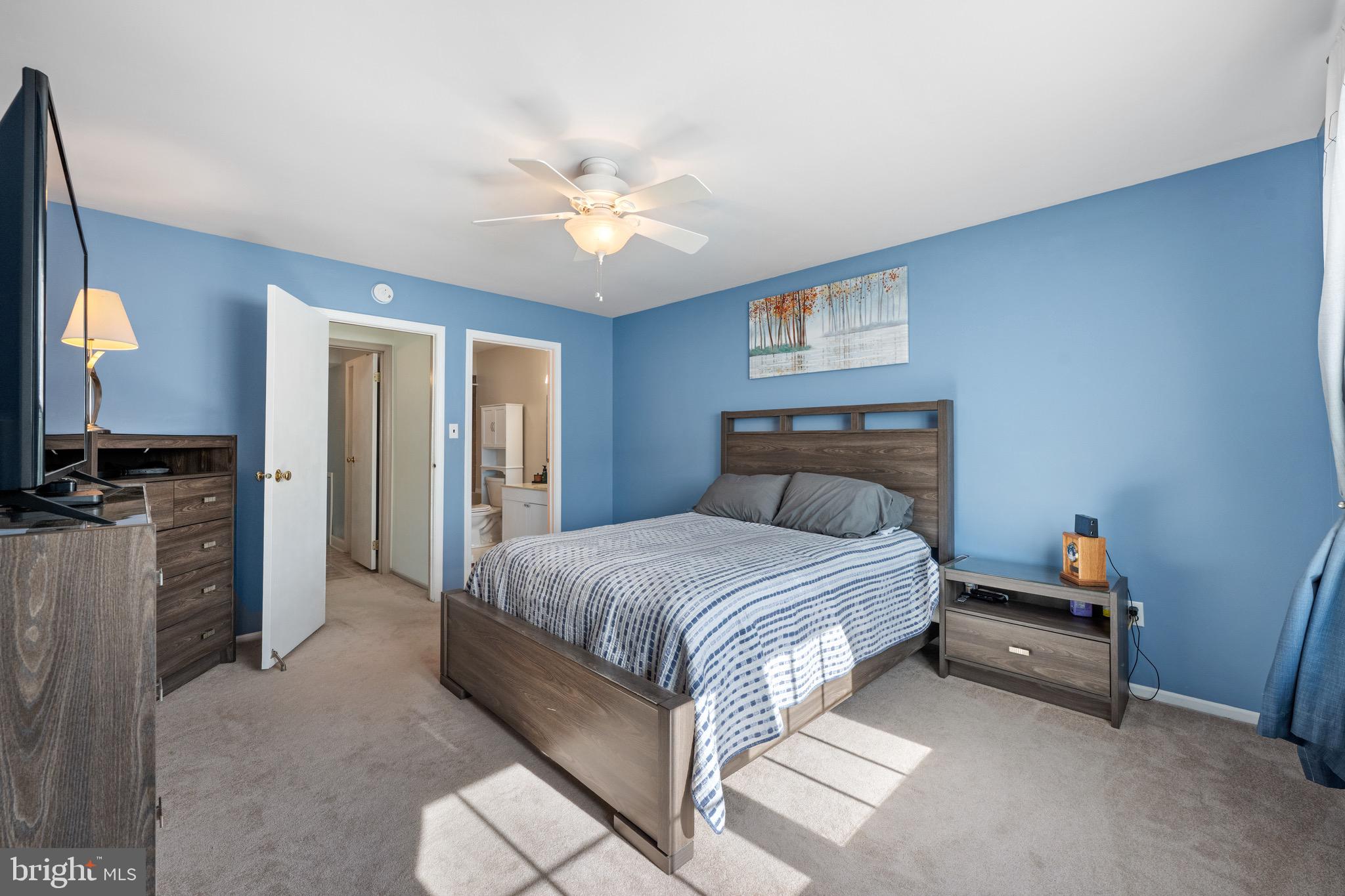 32 Brighton Place Sewell, NJ 08080 - Photo 14 of 21 a spacious bedroom with a bed and a chandelier