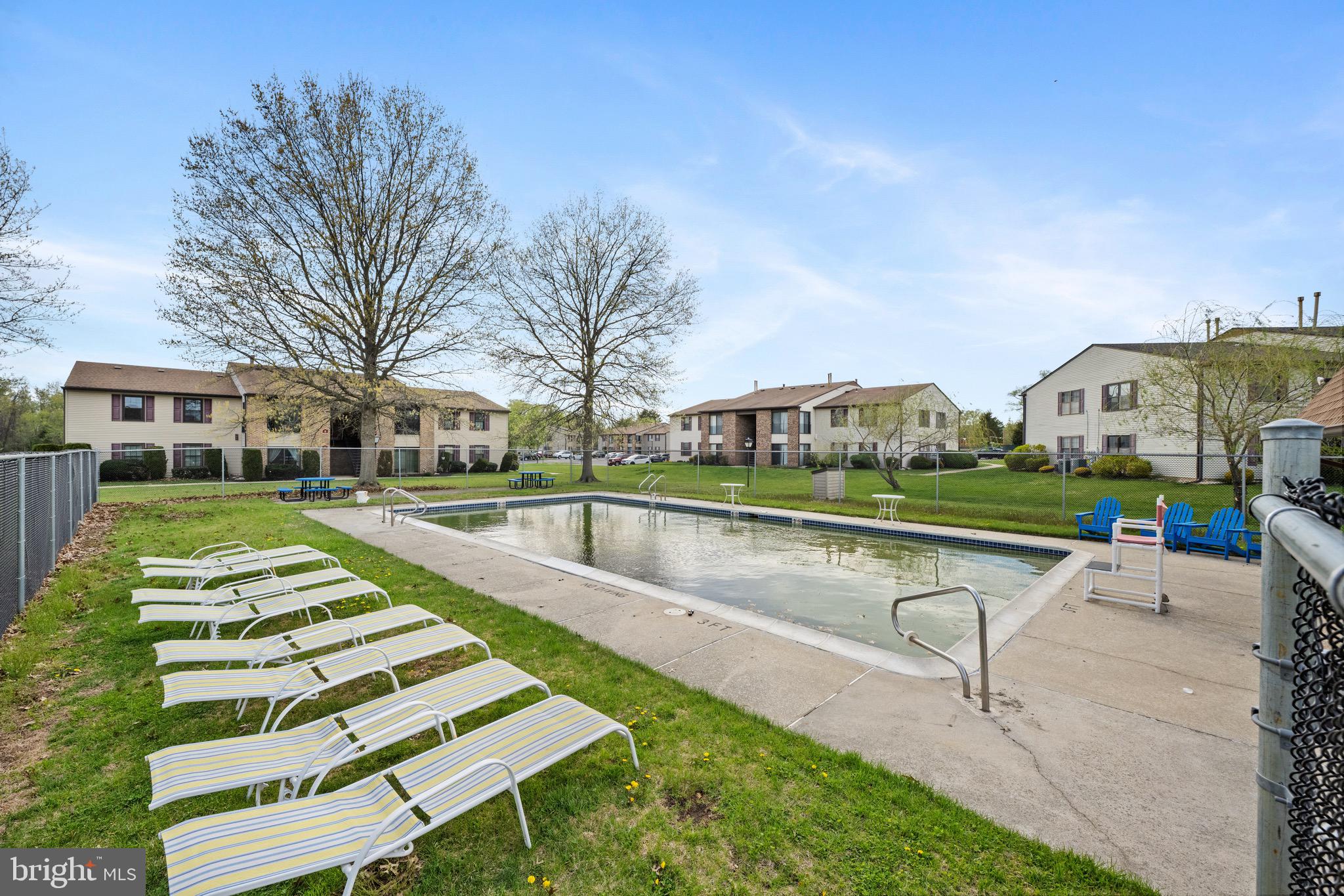 32 Brighton Place Sewell, NJ 08080 - Photo 19 of 21 a view of swimming pool with seating area and trees around