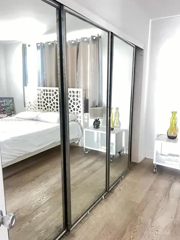 a bathroom with a toilet a sink and a shower curtain