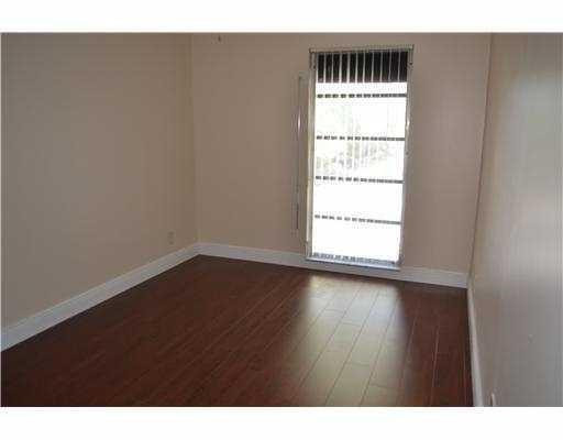 2801 North 34th Avenue Hollywood, FL 33021 - Photo 5 of 9 a view of an empty room with wooden floor and a window