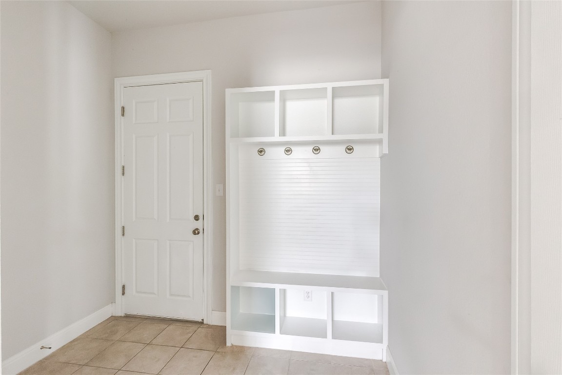 1948 Equine Road Leander, TX 78641 - Photo 29 of 36 Mudroom featuring light tile patterned flooring and baseboards