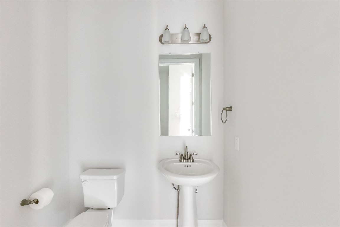 1948 Equine Road Leander, TX 78641 - Photo 30 of 36 Half bathroom featuring toilet