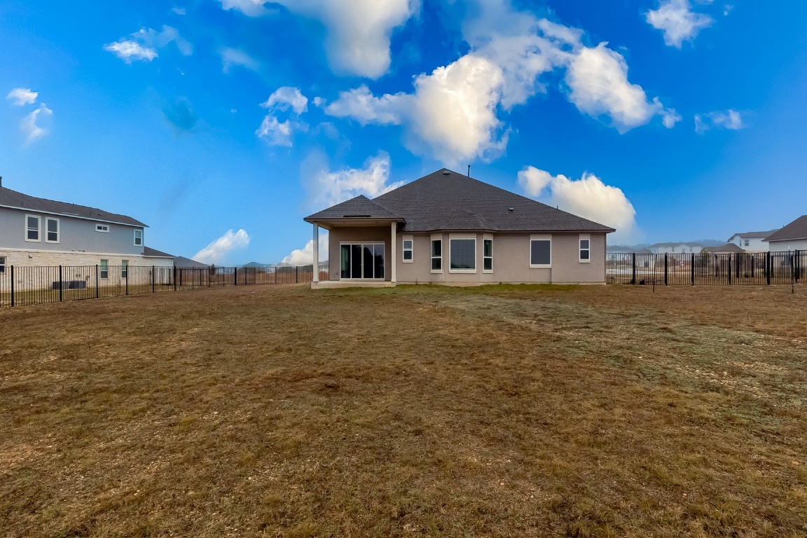1948 Equine Road Leander, TX 78641 - Photo 33 of 36 Rear view of property with a patio and a fenced backyard