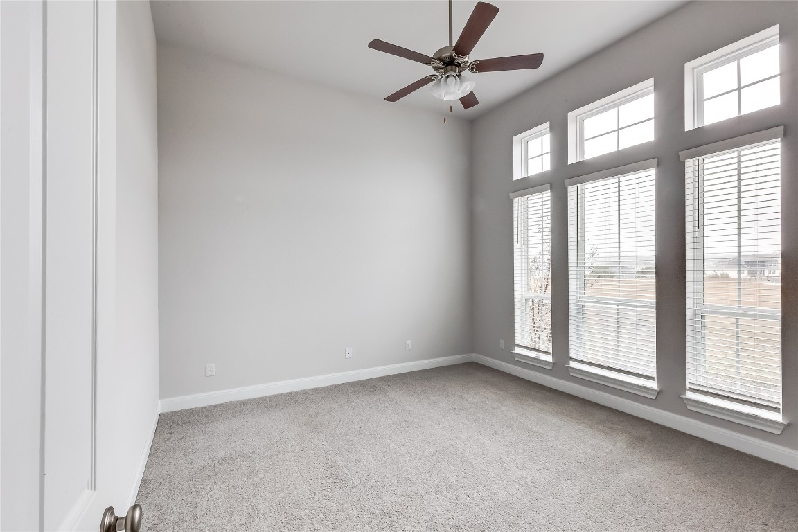 1948 Equine Road Leander, TX 78641 - Photo 5 of 36 Spare room featuring a ceiling fan and light carpet