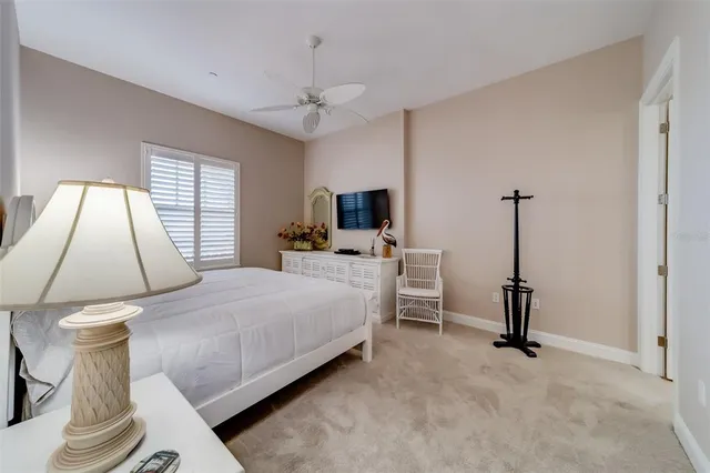 a bathroom with a granite countertop sink and a toilet