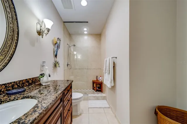 a kitchen with stainless steel appliances granite countertop a stove and a sink with granite countertops