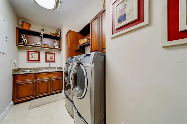a kitchen with a refrigerator and a sink
