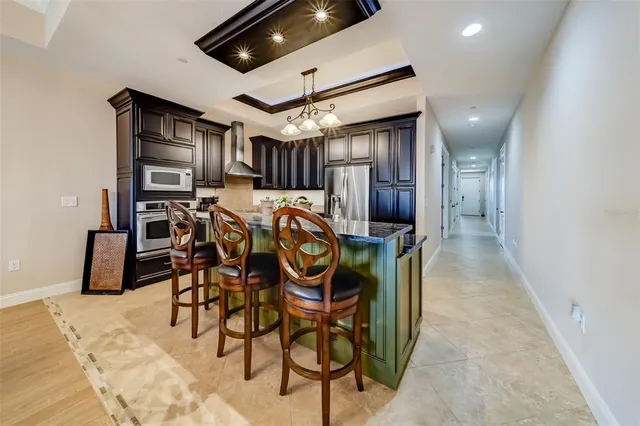 a balcony with furniture and a floor to ceiling window