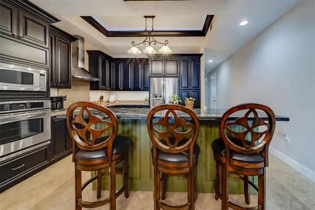 a view of a dining room with furniture and a table