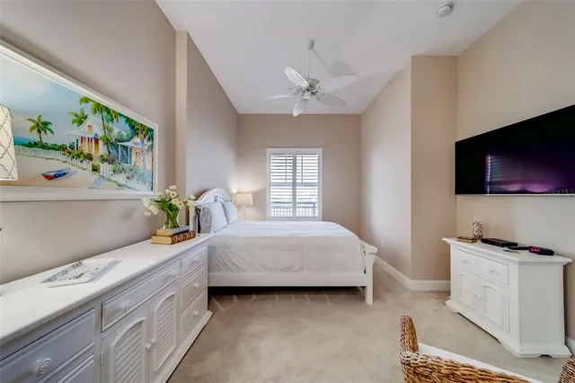 a bedroom with a bed and a lamp