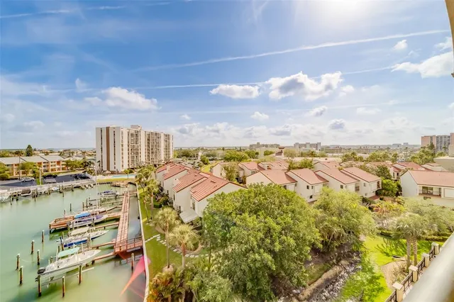 an aerial view of a city with ocean view