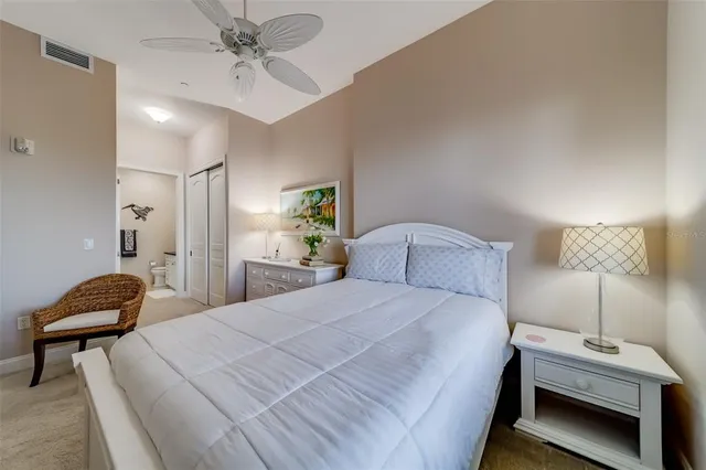 a view of a hallway with wooden floor and closet