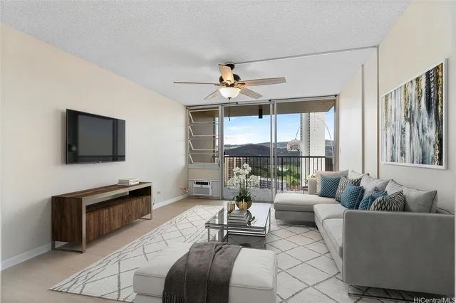 a living room with furniture a flat screen tv and a large window