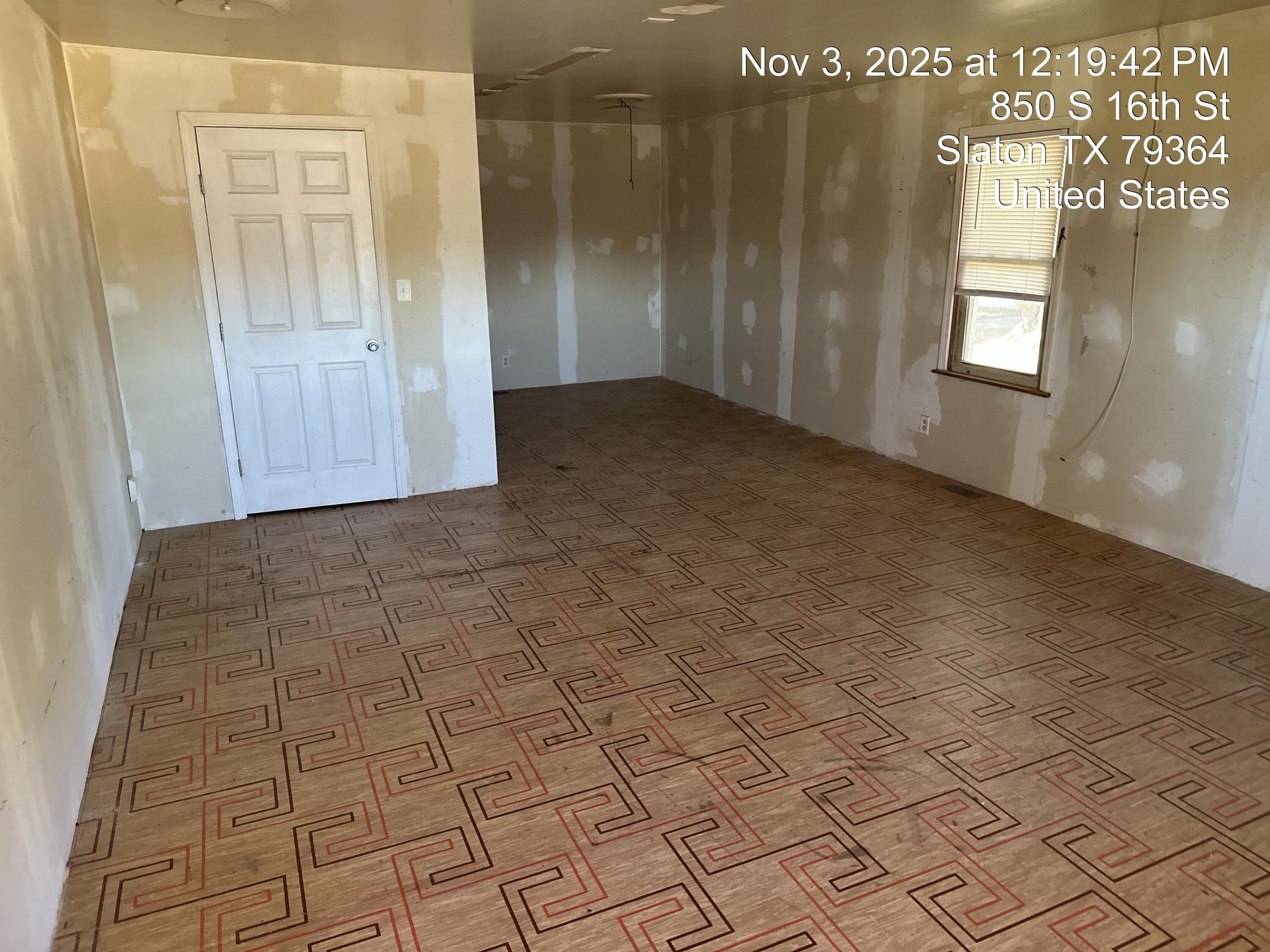 850 South 16th Street Slaton, TX 79364 - Photo 15 of 17 a view of an empty room and window