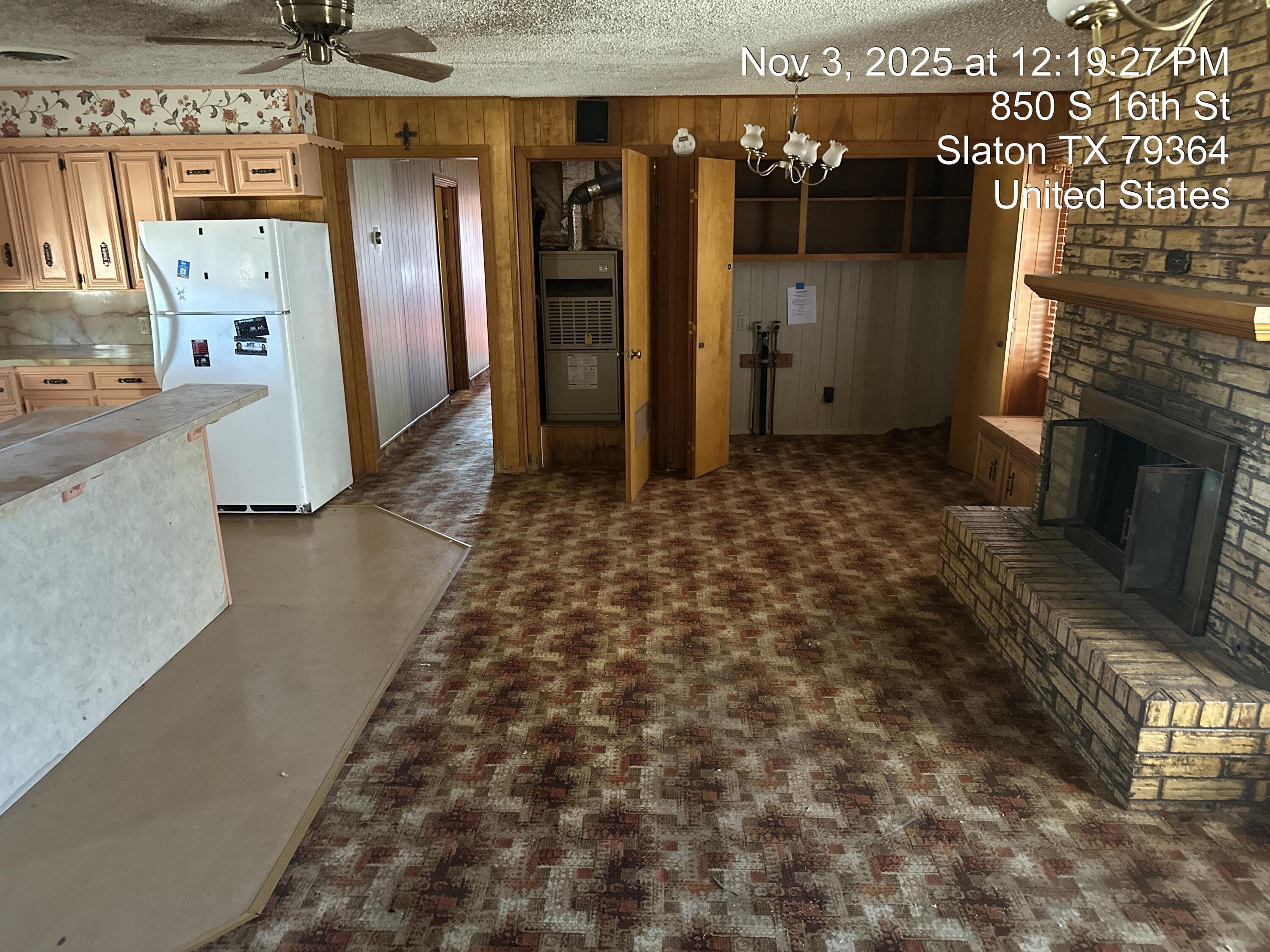 850 South 16th Street Slaton, TX 79364 - Photo 6 of 17 a view of a hallway with wooden floor and staircase