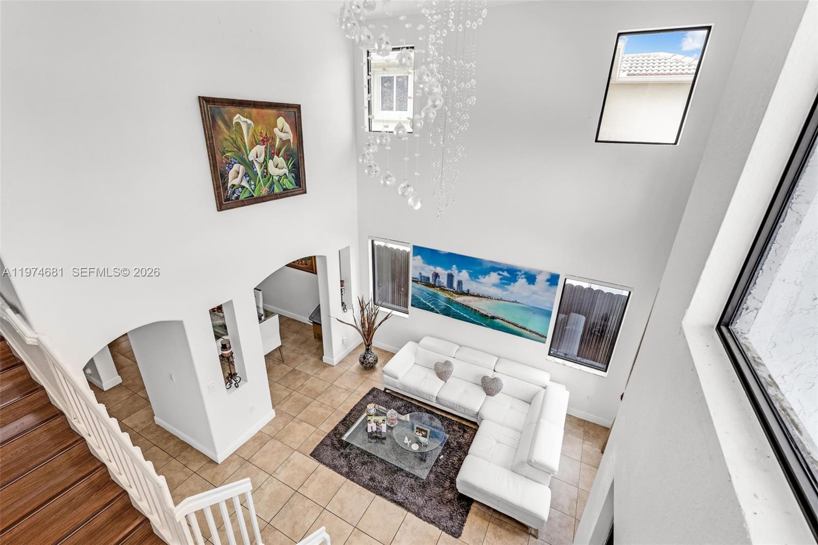 16610 Southwest 57th Lane Miami, FL 33193 - Photo 21 of 57 a living room with furniture and a flat screen tv