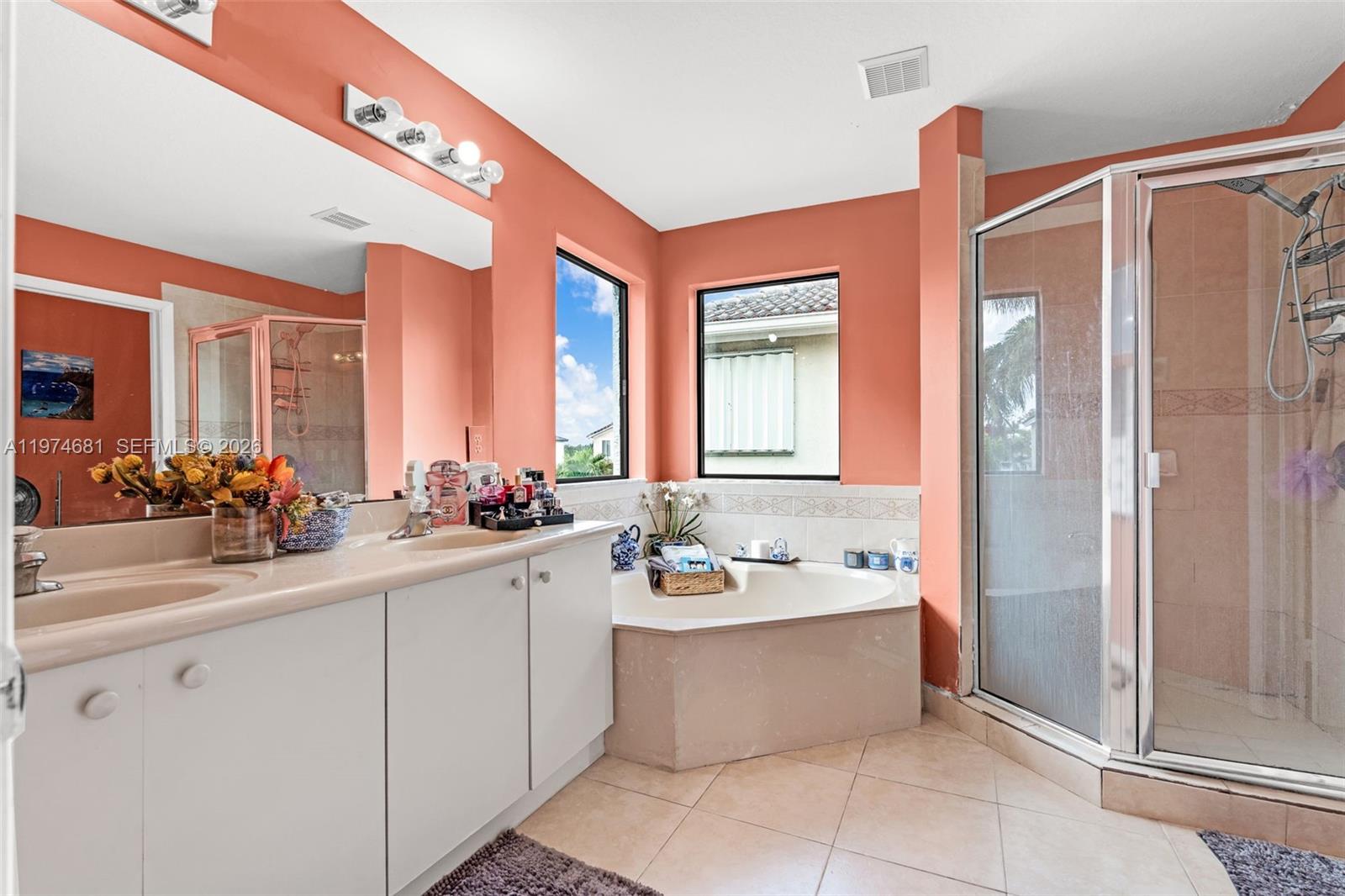 16610 Southwest 57th Lane Miami, FL 33193 - Photo 33 of 57 a bathroom with a double vanity sink mirror and bathtub