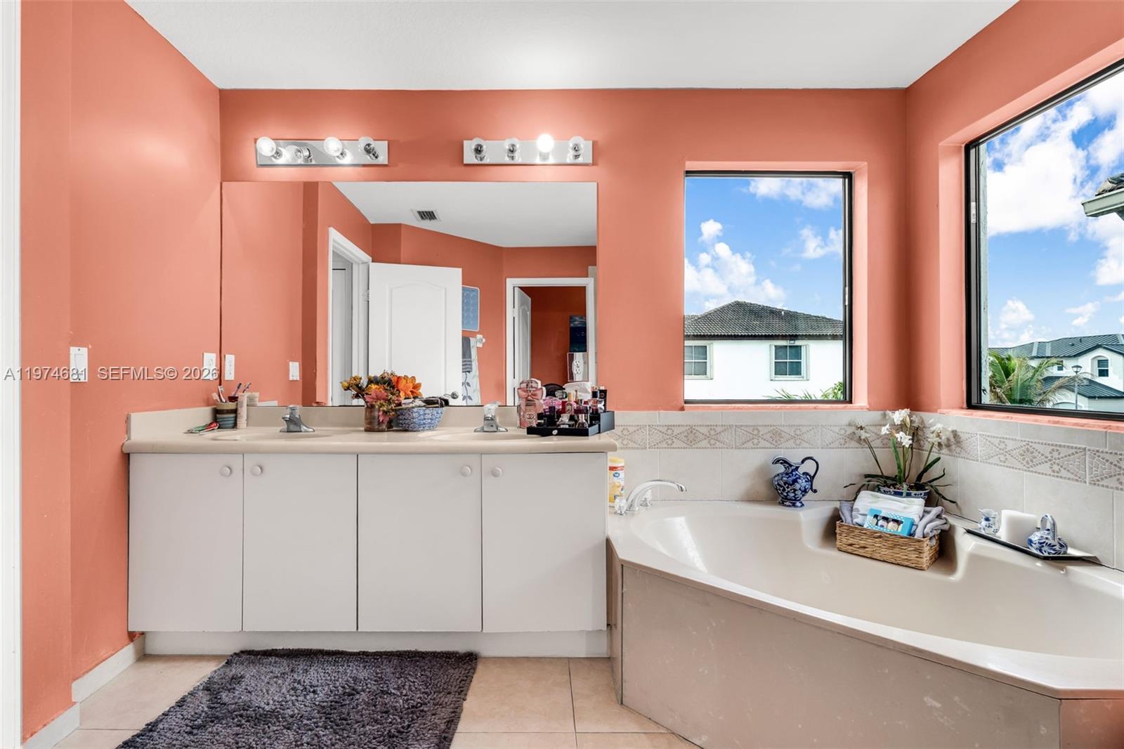 16610 Southwest 57th Lane Miami, FL 33193 - Photo 34 of 57 a bathroom with a sink and a mirror