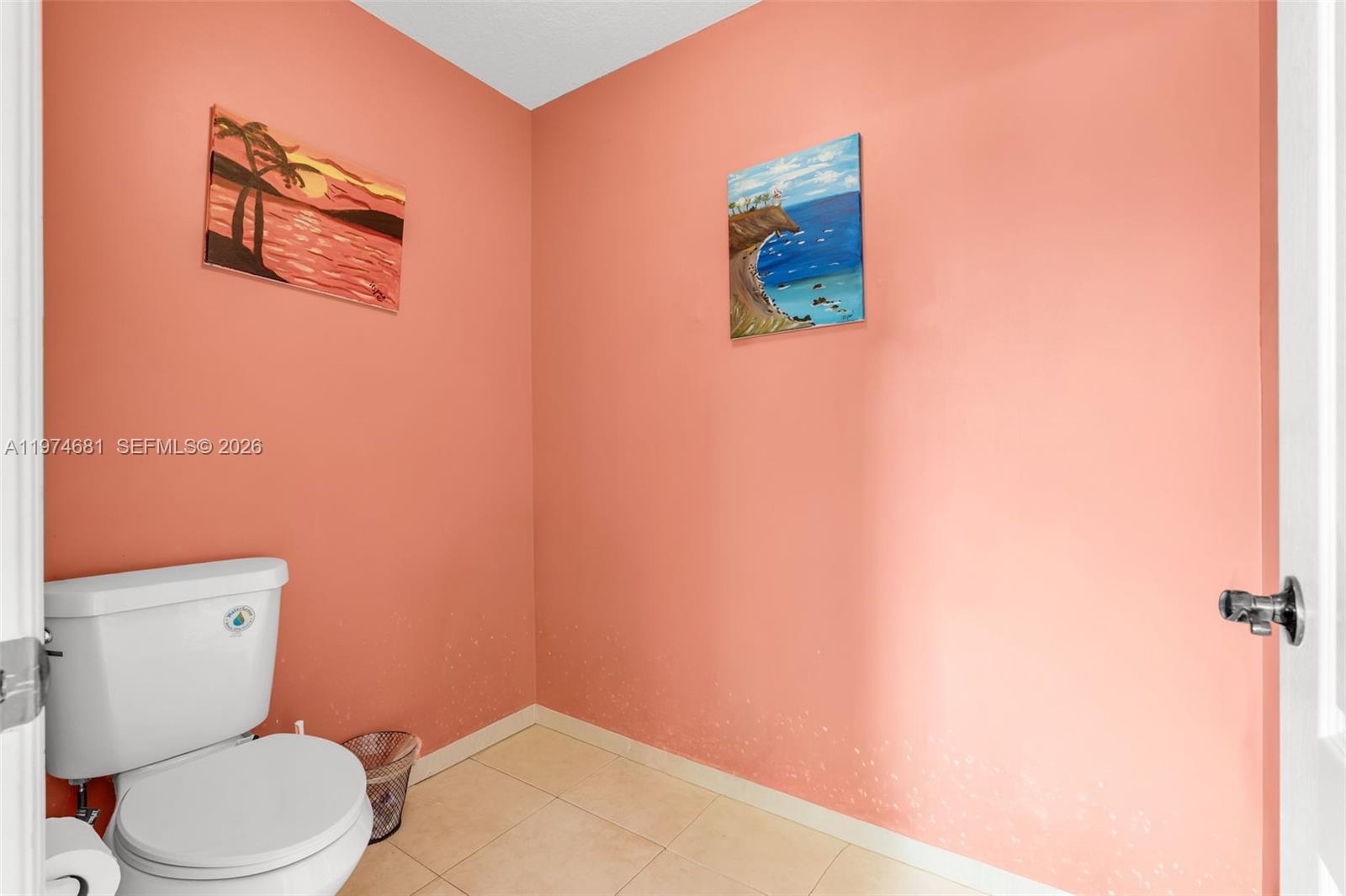 16610 Southwest 57th Lane Miami, FL 33193 - Photo 35 of 57 a bathroom with a toilet and a shower curtain