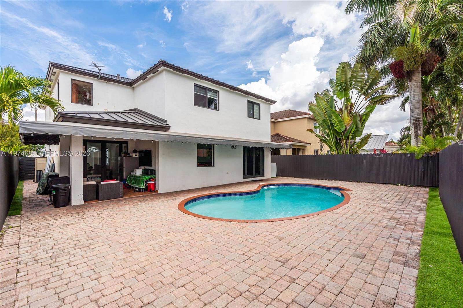 16610 Southwest 57th Lane Miami, FL 33193 - Photo 38 of 57 a front view of a house with outdoor space