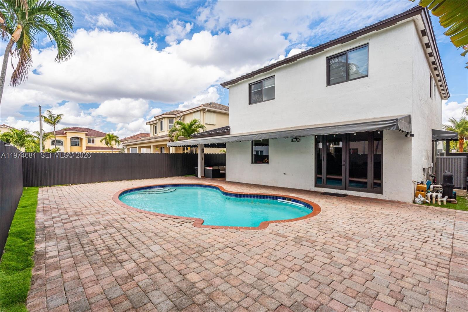 16610 Southwest 57th Lane Miami, FL 33193 - Photo 39 of 57 a front view of a house with swimming pool