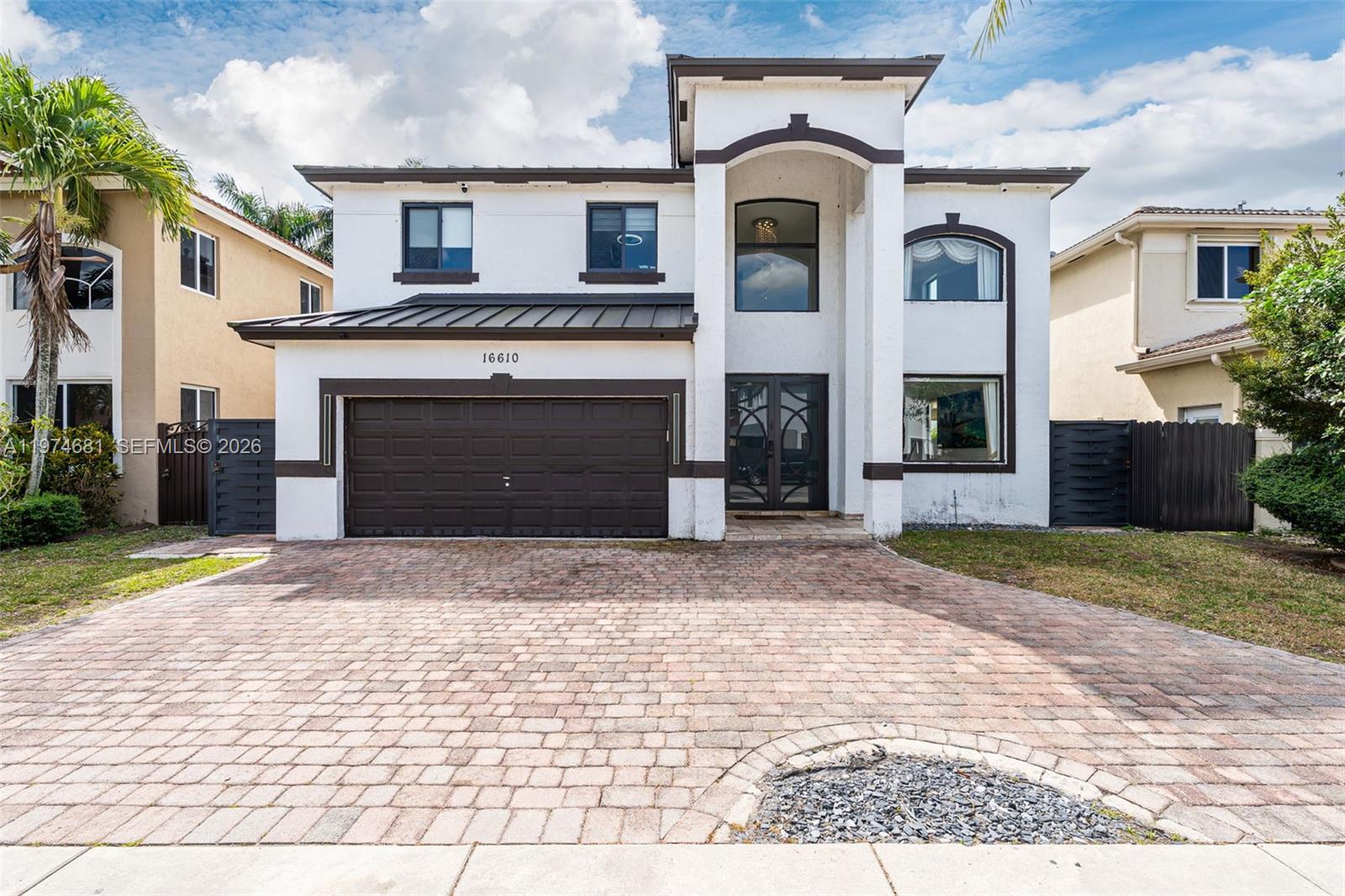 16610 Southwest 57th Lane Miami, FL 33193 - Photo 4 of 57 front view of a house with a yard