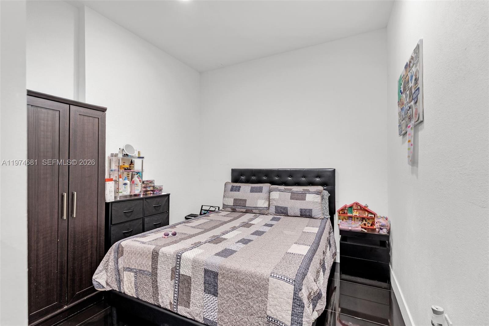 16610 Southwest 57th Lane Miami, FL 33193 - Photo 47 of 57 a bedroom with a bed and wooden floor