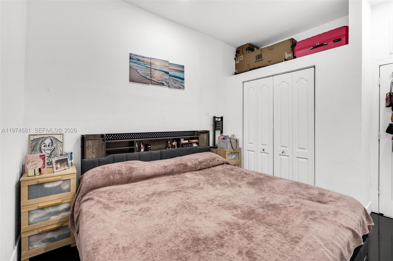 16610 Southwest 57th Lane Miami, FL 33193 - Photo 50 of 57 a bedroom with a bed and a window