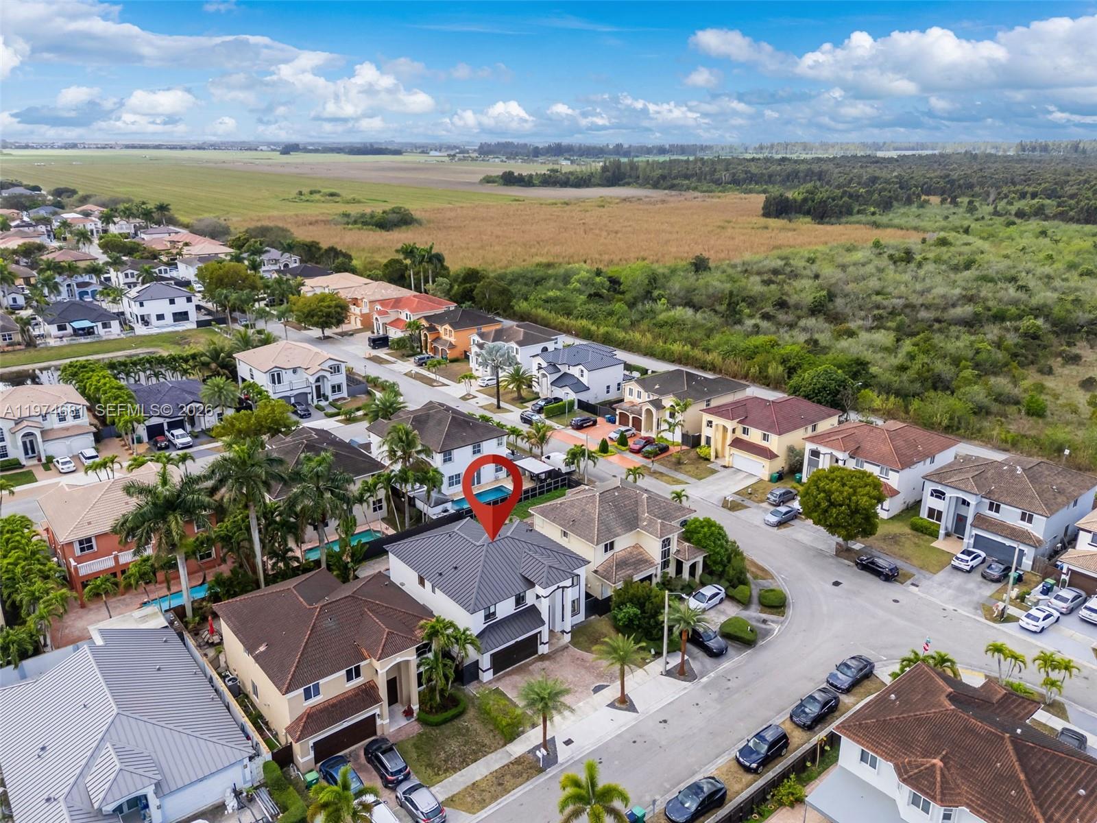 16610 Southwest 57th Lane Miami, FL 33193 - Photo 52 of 57 an aerial view of ocean and residential houses with outdoor space