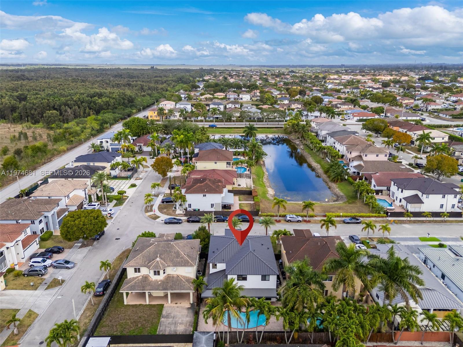 16610 Southwest 57th Lane Miami, FL 33193 - Photo 56 of 57 a view of a city with lots of residential buildings ocean and mountain view in back
