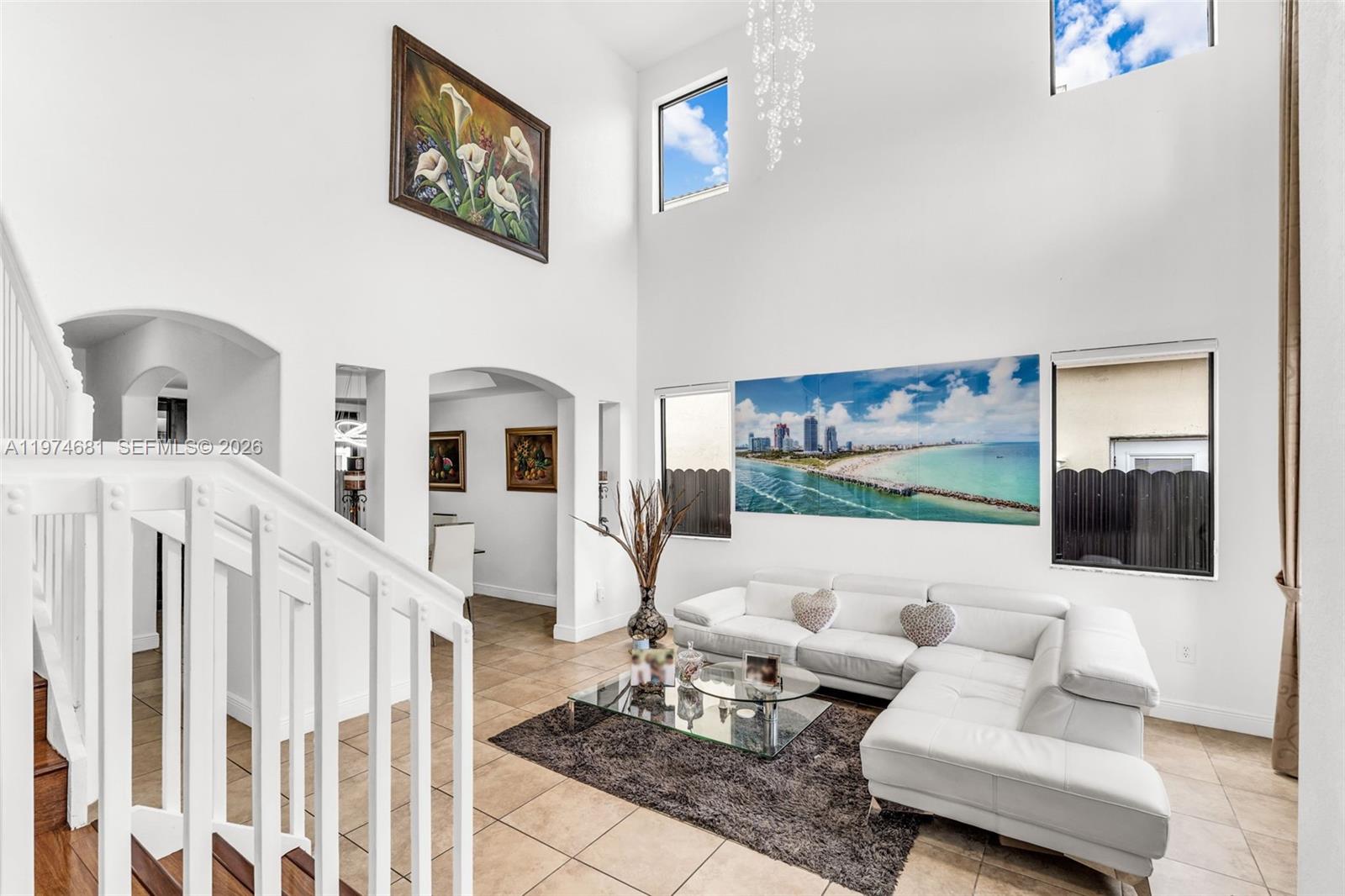 16610 Southwest 57th Lane Miami, FL 33193 - Photo 6 of 57 a living room with furniture and a flat screen tv