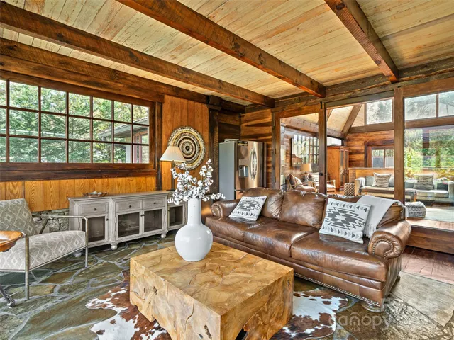 a bedroom with a balcony a bed and a couch