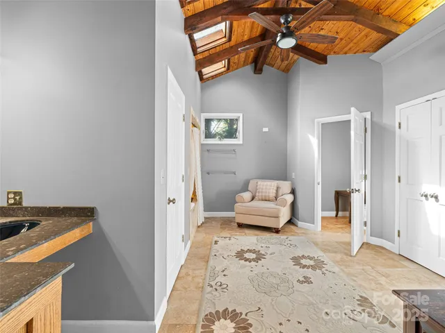 a view of a bathroom with a shower and a sink