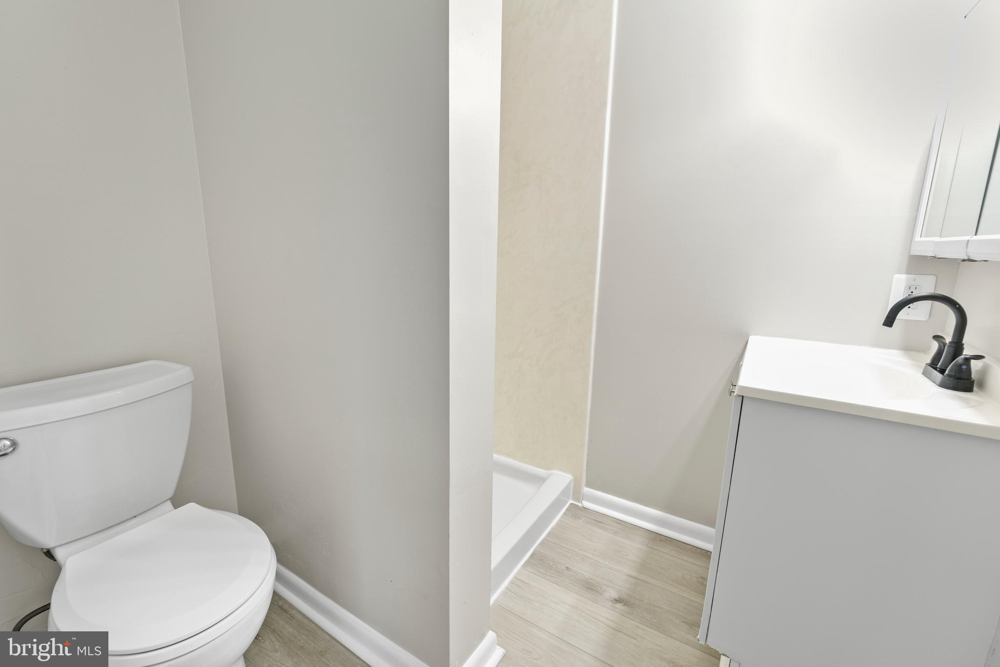 5134 Perry Road Mount Airy, MD 21771 - Photo 21 of 28 a white toilet sitting next to a sink