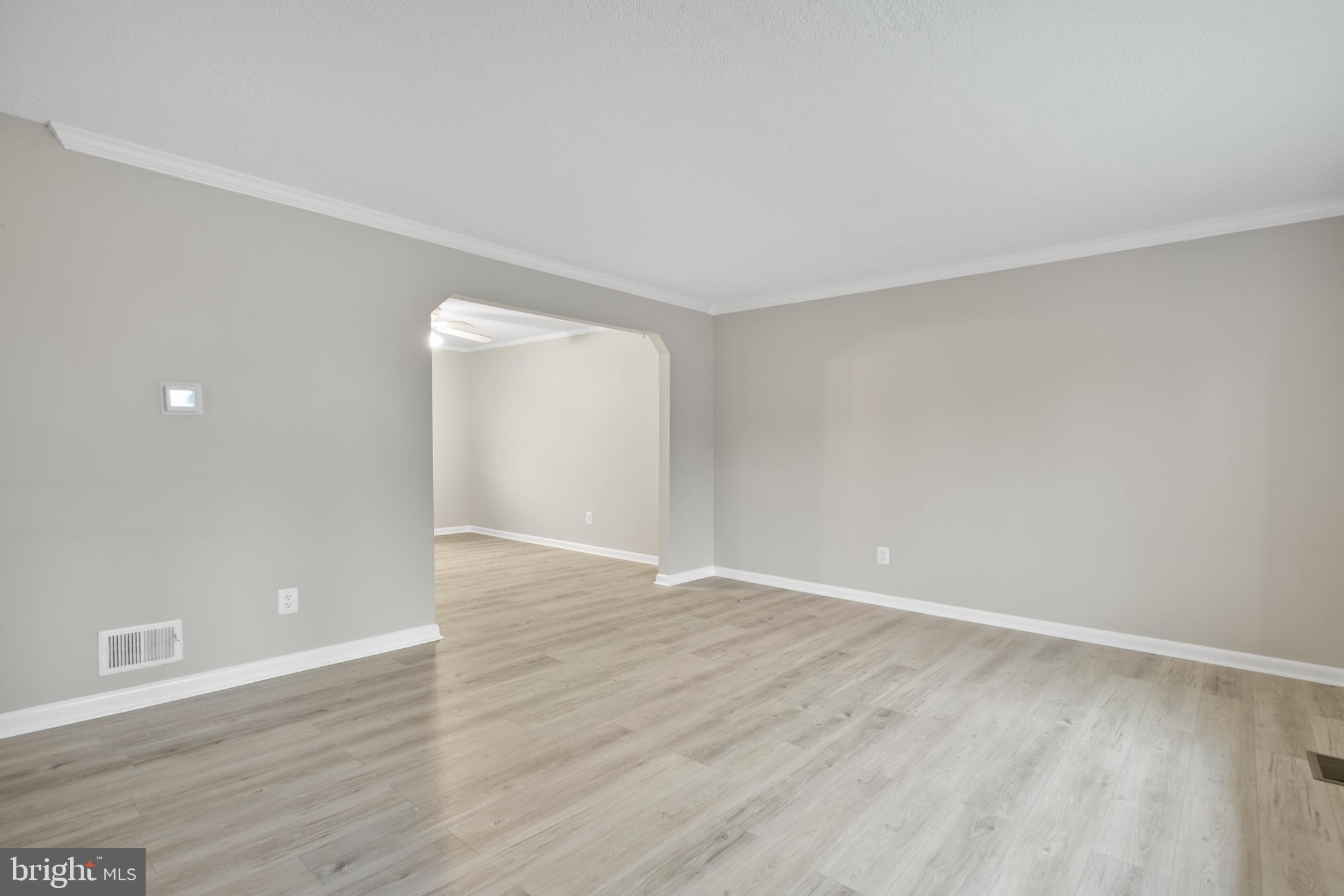5134 Perry Road Mount Airy, MD 21771 - Photo 6 of 28 a view of an empty room with wooden floor and a window