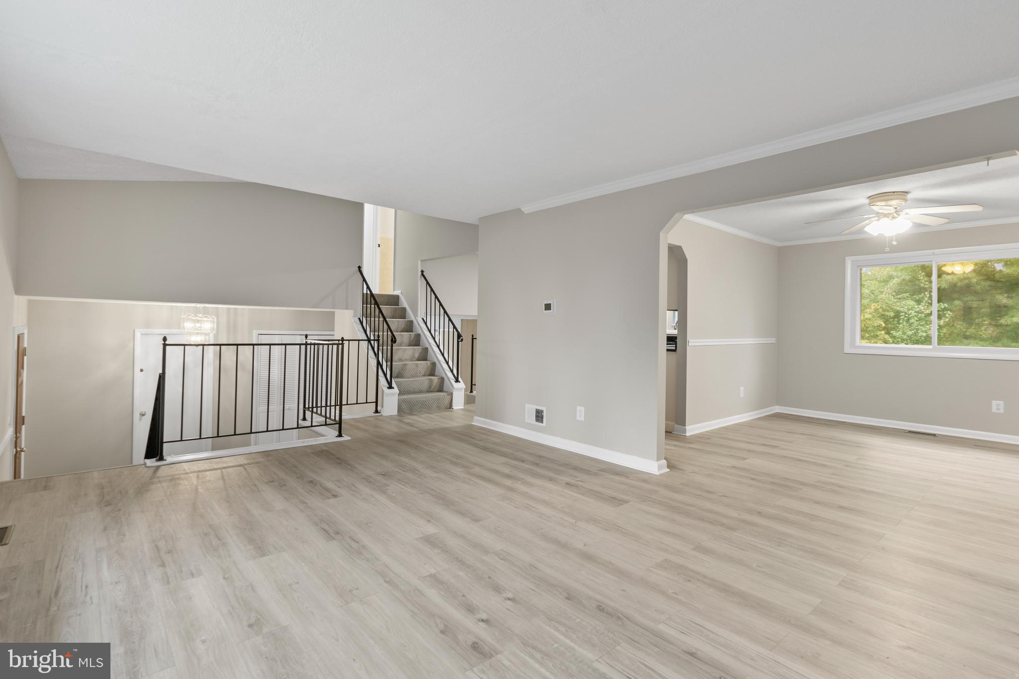5134 Perry Road Mount Airy, MD 21771 - Photo 7 of 28 a view of an empty room with wooden floor and a window