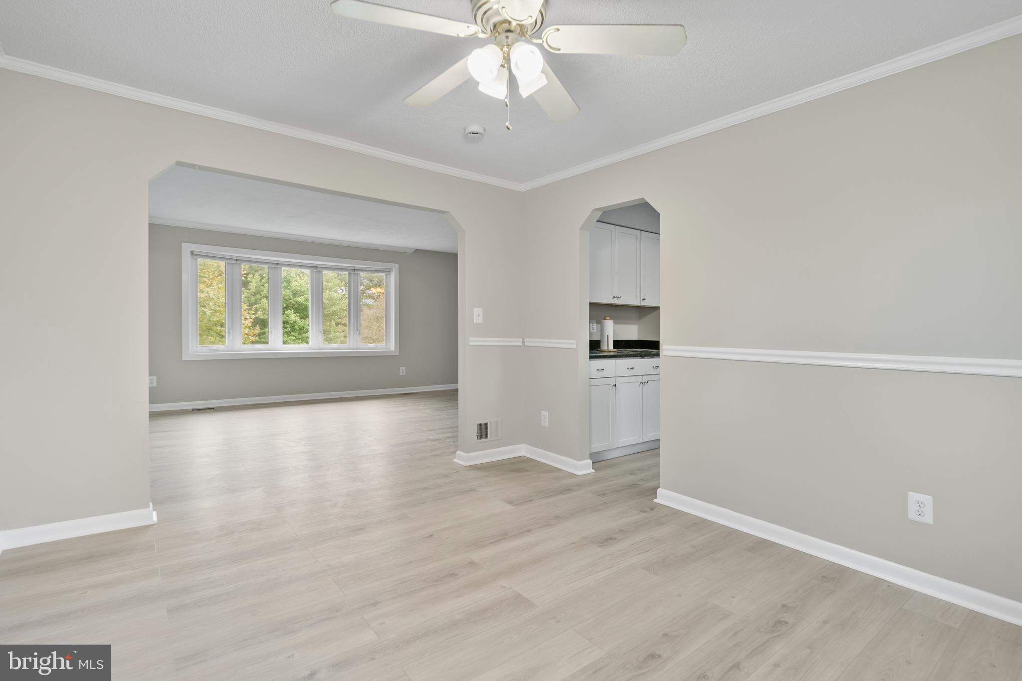 5134 Perry Road Mount Airy, MD 21771 - Photo 8 of 28 wooden floor in an empty room with a window