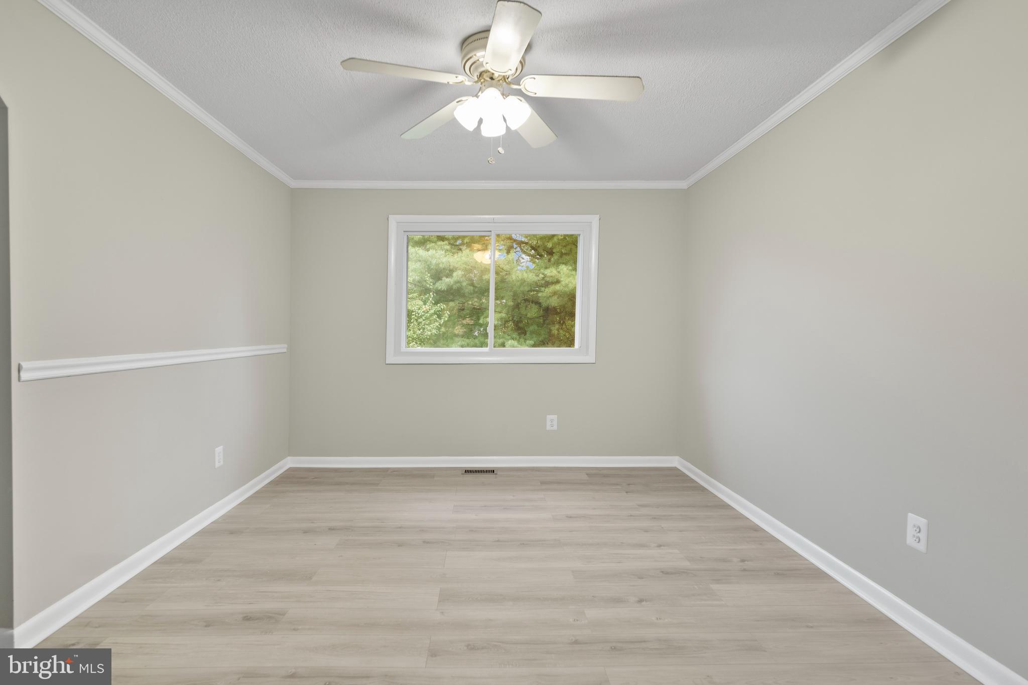 5134 Perry Road Mount Airy, MD 21771 - Photo 9 of 28 wooden floor in an empty room with a window