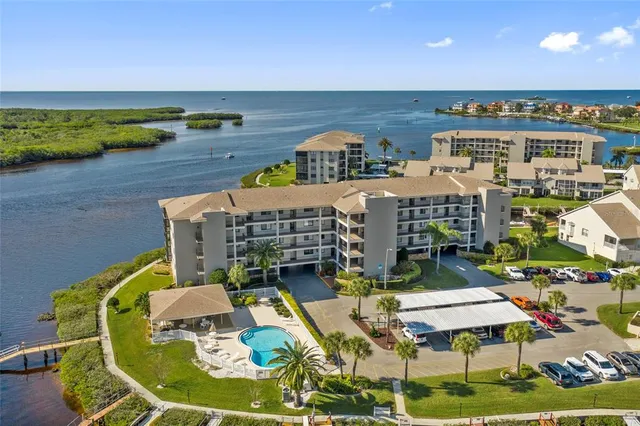 a roof deck with dining table and chairs