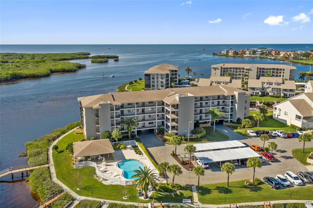 8141 Aquila Street, Unit 334 Port Richey, FL 34668 - Photo 2 of 61 a roof deck with dining table and chairs