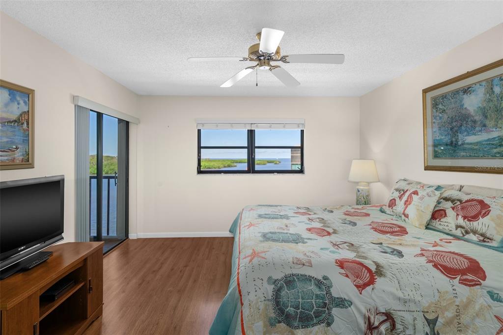 8141 Aquila Street, Unit 334 Port Richey, FL 34668 - Photo 25 of 61 a bedroom with a bed and a flat screen tv