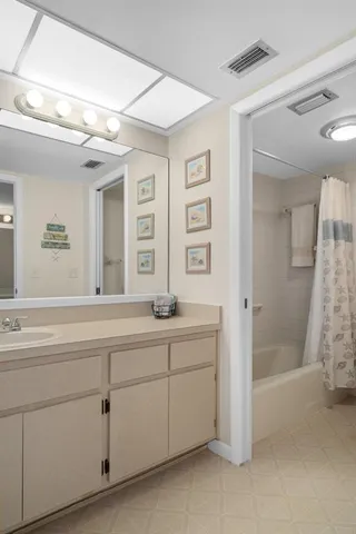 a balcony with wooden floor and lake view