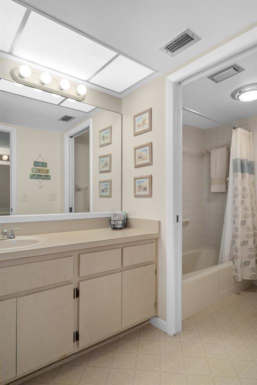 8141 Aquila Street, Unit 334 Port Richey, FL 34668 - Photo 30 of 61 a spacious bathroom with a shower sink and mirror