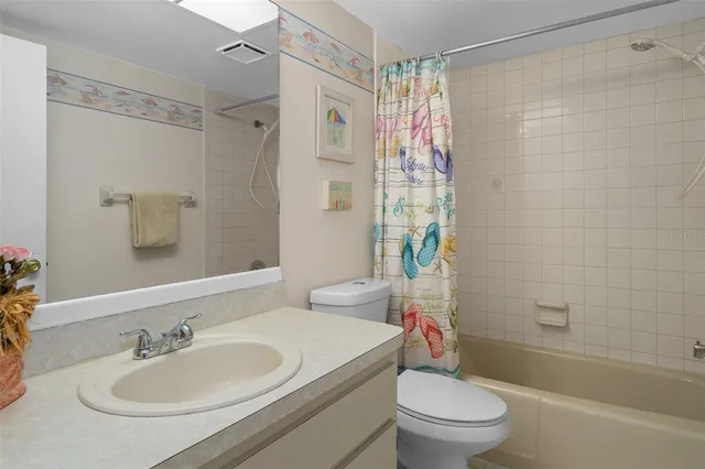 a view of swimming pool with lawn chairs and a big yard