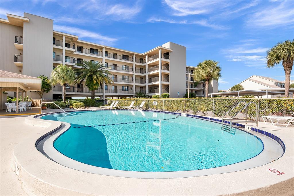 8141 Aquila Street, Unit 334 Port Richey, FL 34668 - Photo 52 of 61 a view of swimming pool with outdoor seating