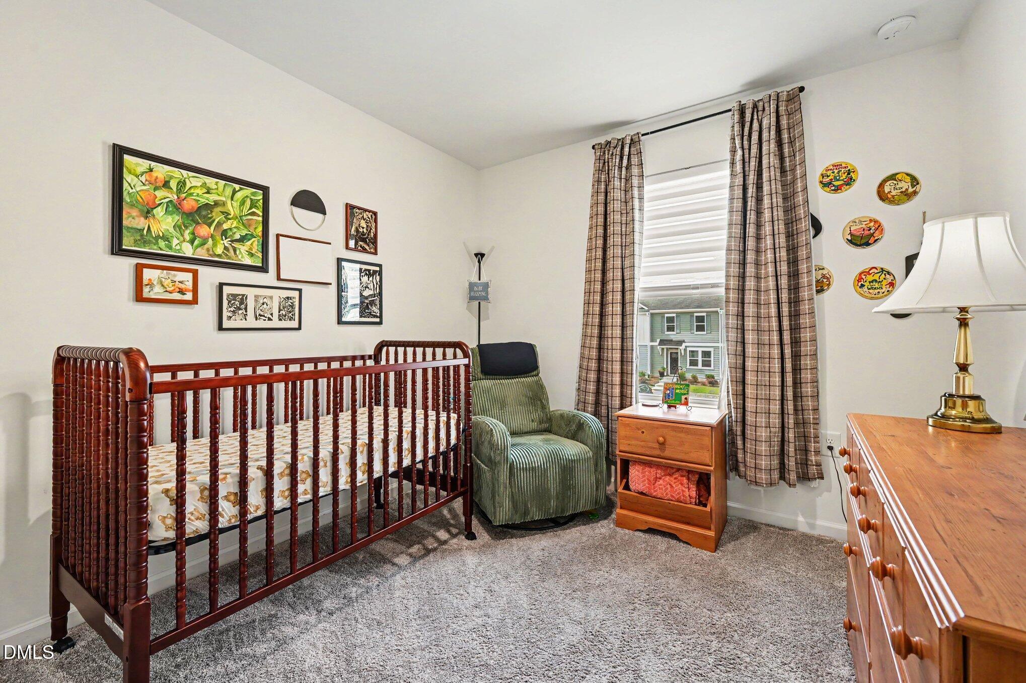 574 Hacksaw Trail Raleigh, NC 27610 - Photo 15 of 28 a bedroom with a bed and a window